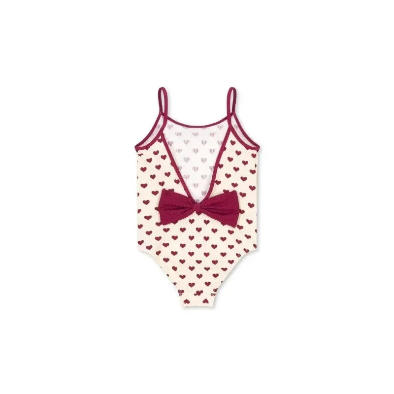 Light girls' swimsuit - stripe long-sleeve, bow accent, nylon, for summer beach days